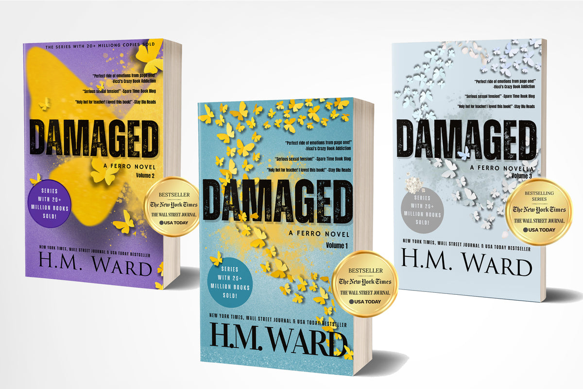 Three paperback books of 'Damaged 1, 2, and 3' by H.M. Ward on a white background